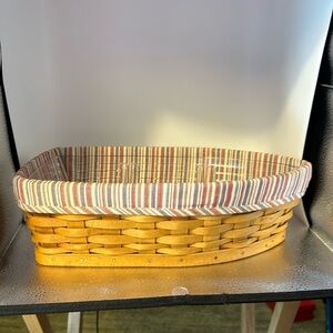 Longaberger boat basket. Very unusual basket includes the liner and protector.​​